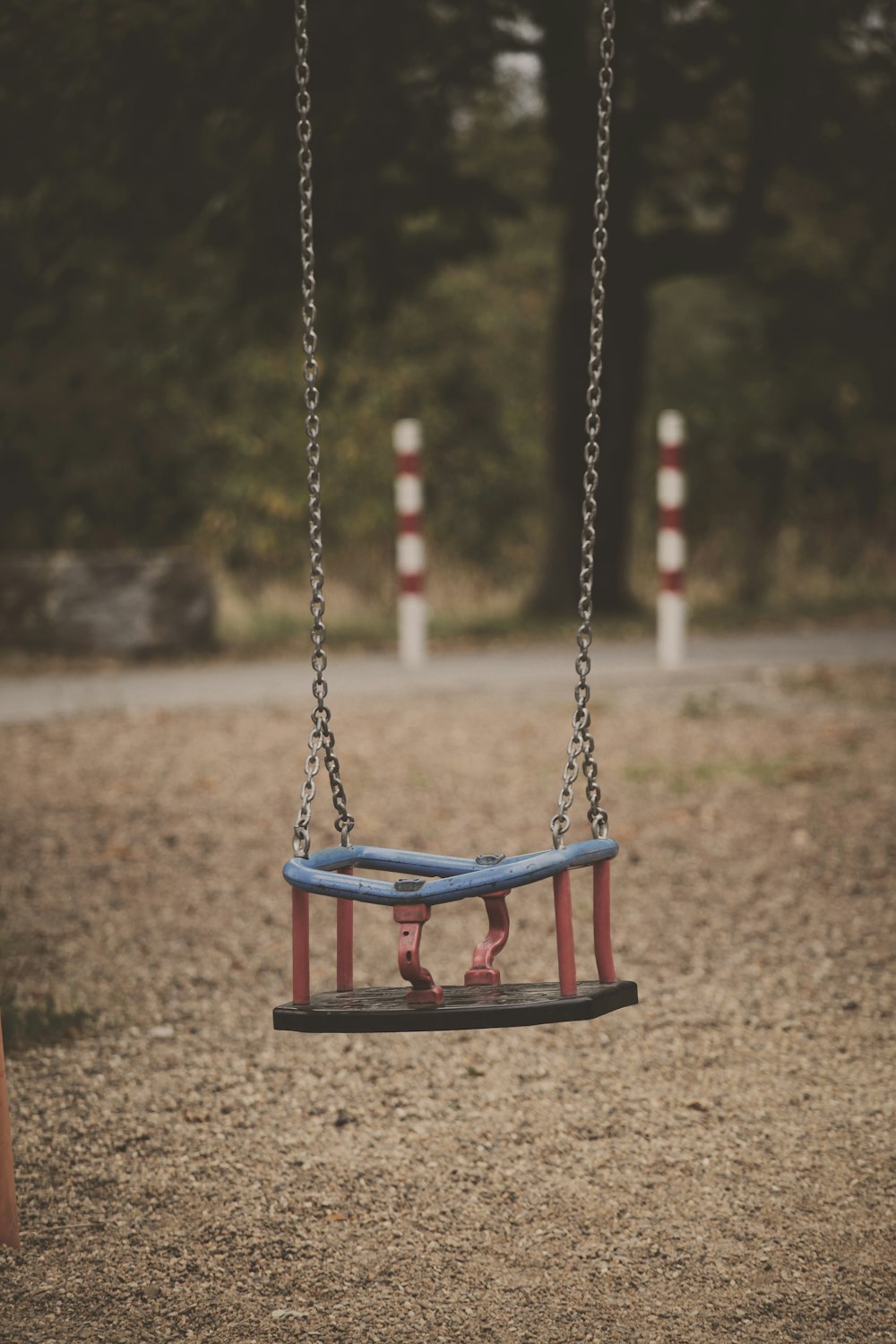 brown, red, and white metal swing macro photography