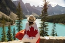 a woman with a canadian flag on her back
