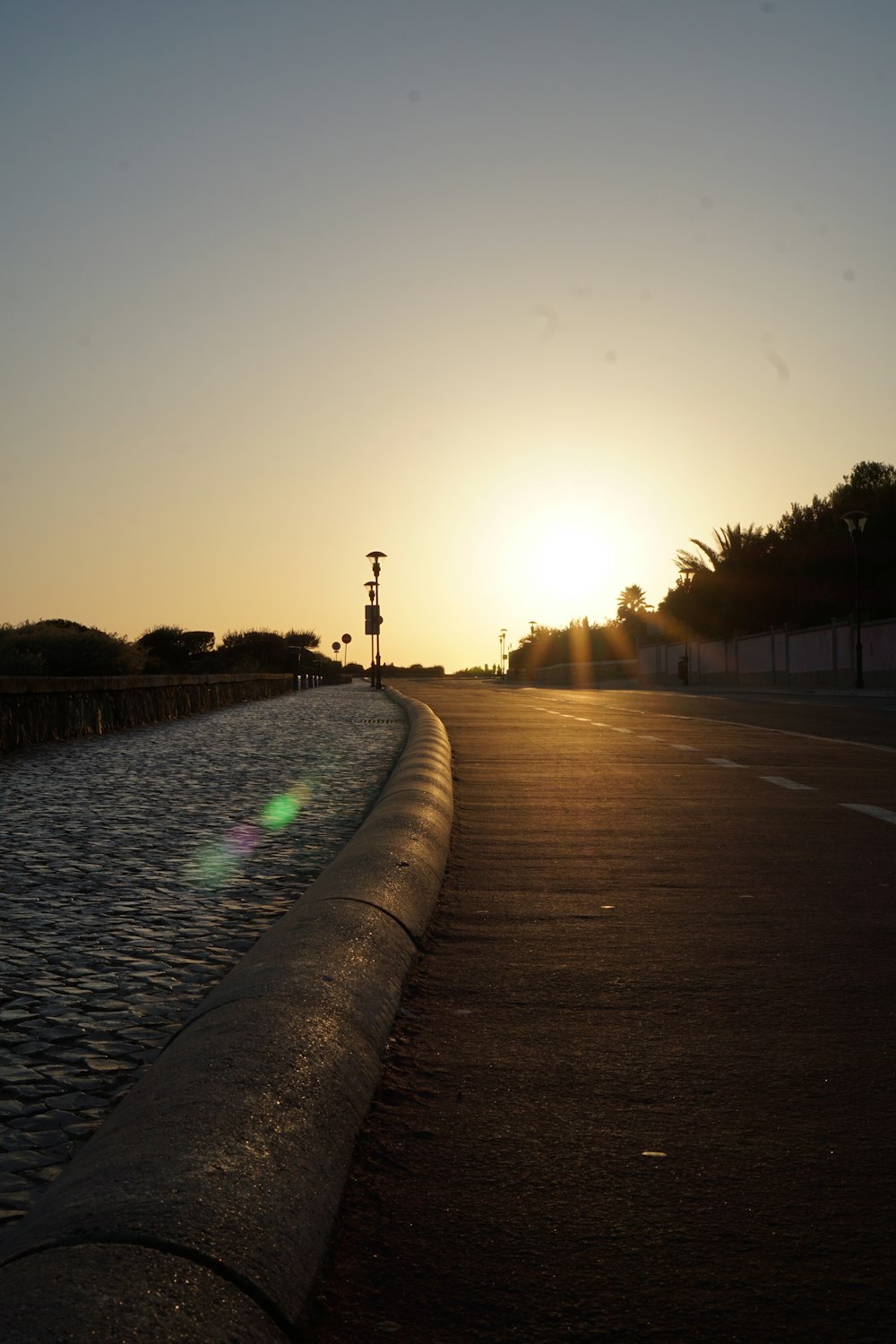 the sun is setting over a body of water