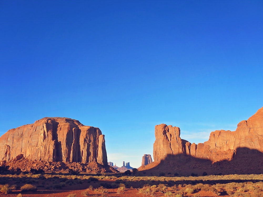 a desert landscape with mountains in the background