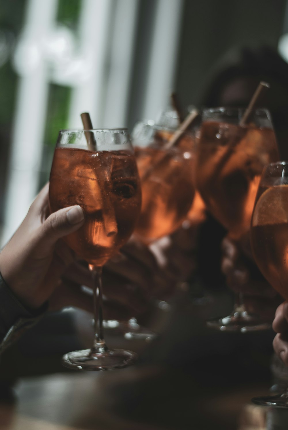 selective focus of people cheering with wine glasses