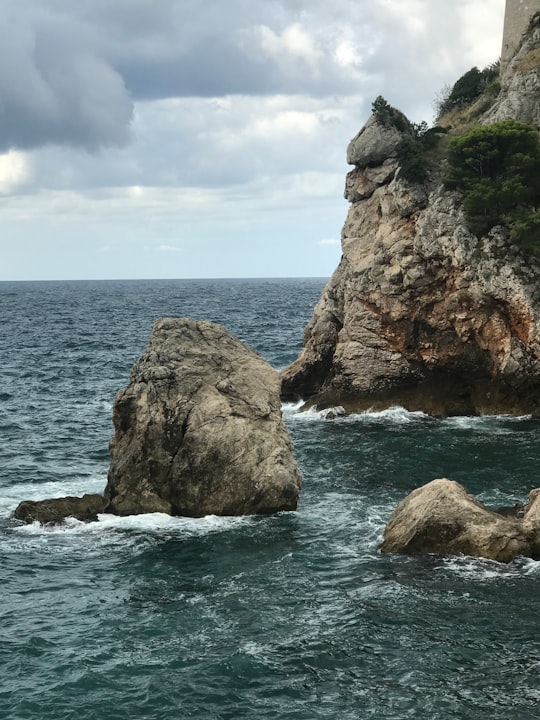 sea waves during daytime in Dubrovnik Castle Croatia