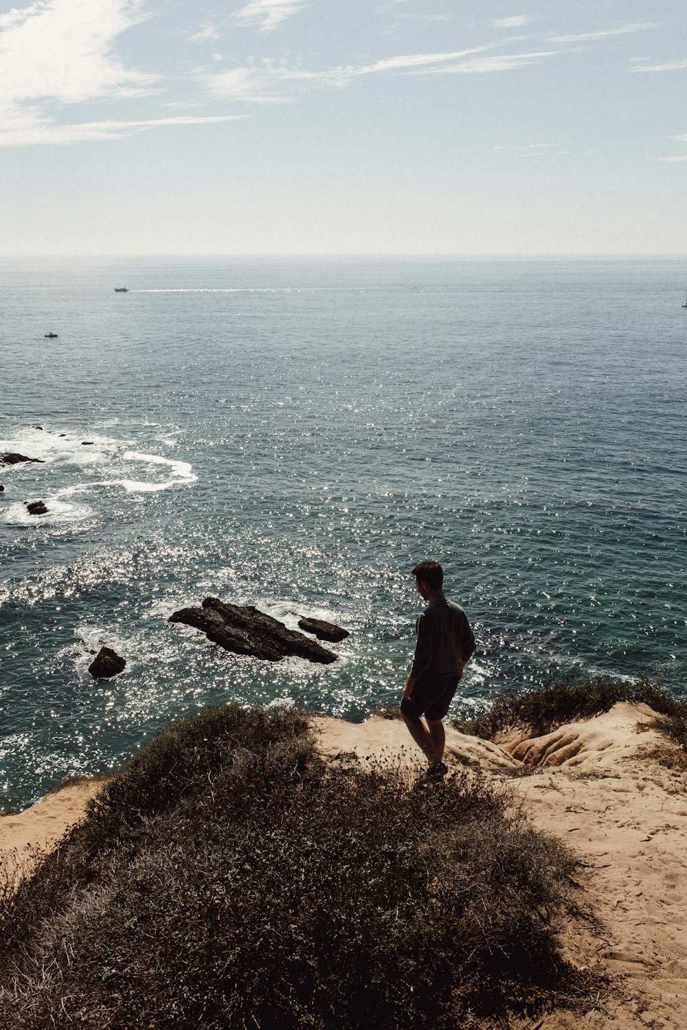 person standing on rock during daytime