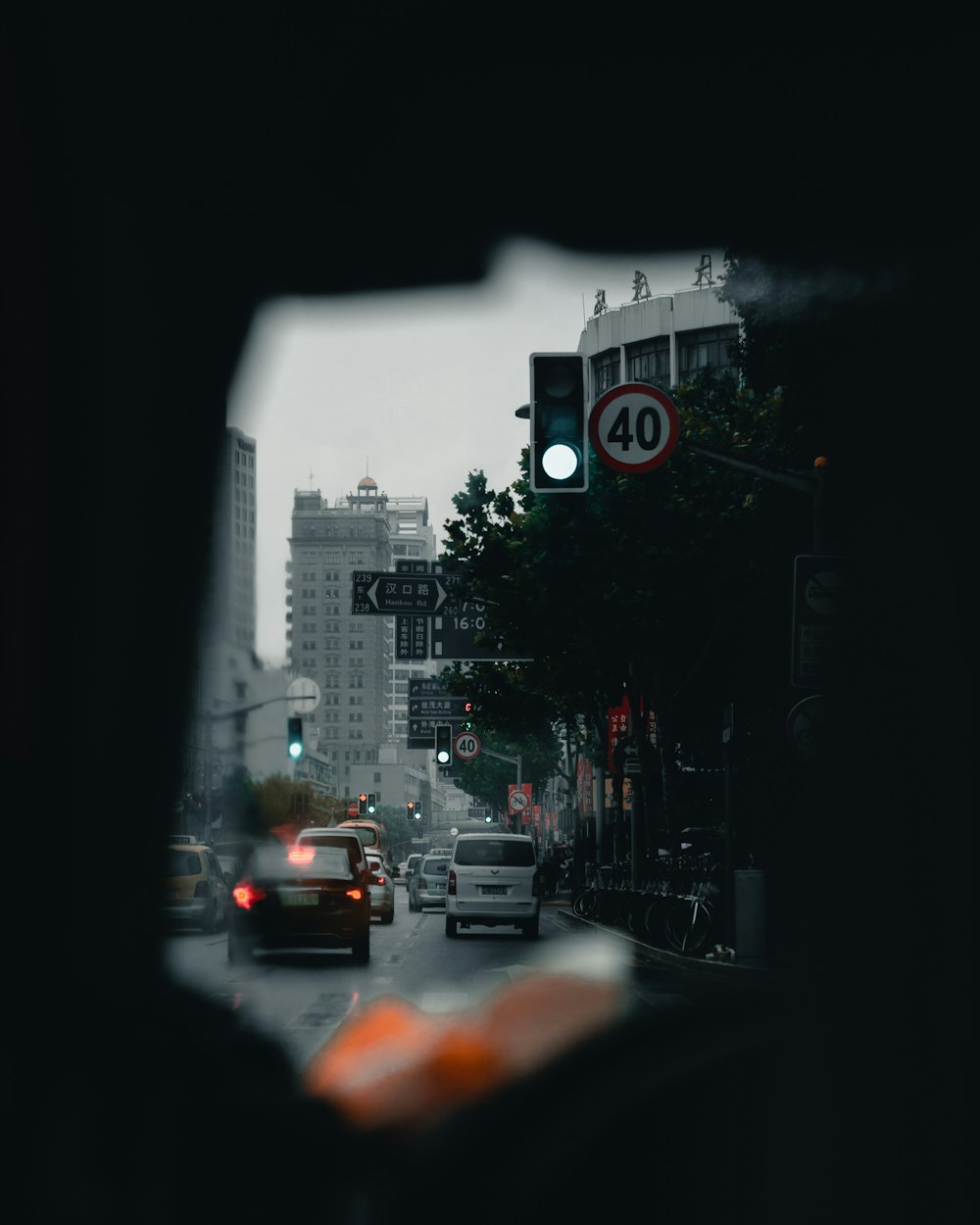 cars on road near buildings during day