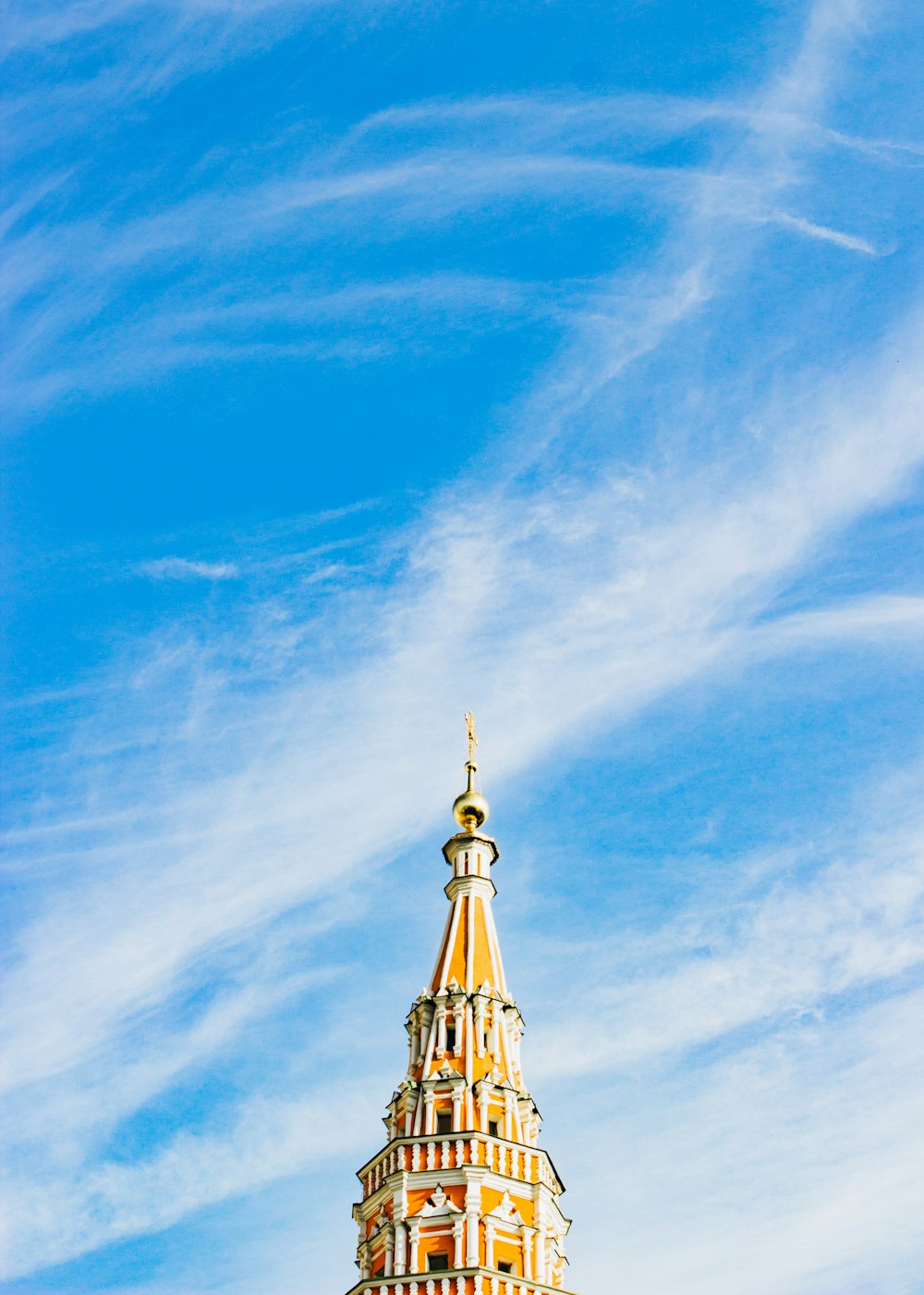 beige and white tower under blue sky