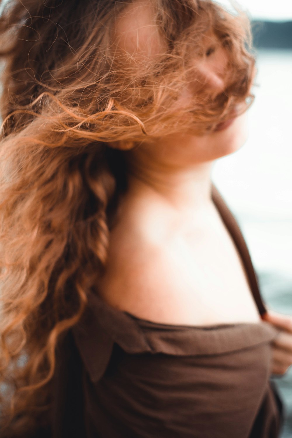 woman wearing brown top