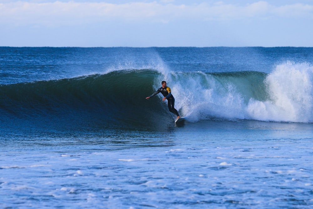 man surfing on waves