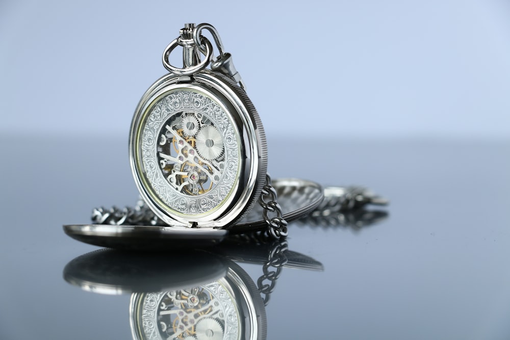 silver-colored pocketwatch
