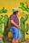 man standing beside wall with cacti mural