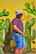 man standing beside wall with cacti mural