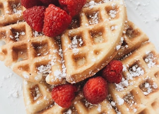 red strawberries on brown waffles