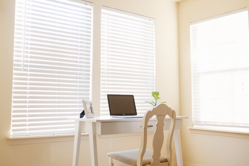 white wooden chair in front of desk