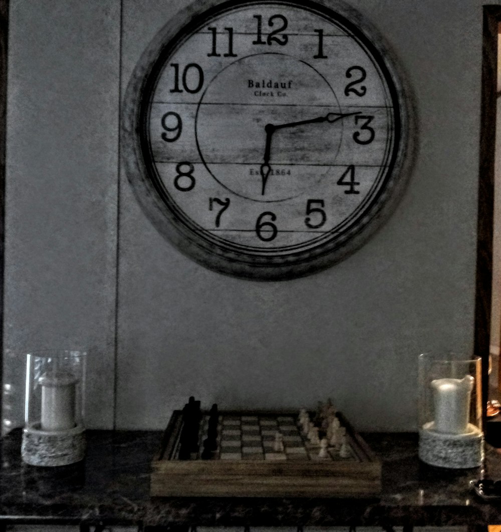 grayscale photography of clock at 6:14