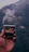 Hands holding a coffee cup with a backdrop of Himalayan mountain silhouettes under starry skies.