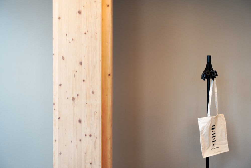 a bag hanging from a hook on a wall