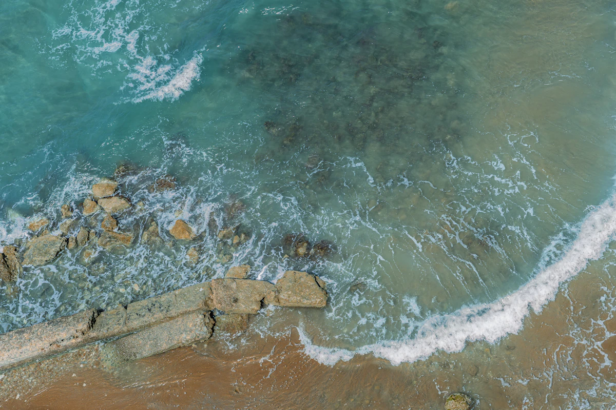 Aerial view of Corfu's turquoise coastline and green hills