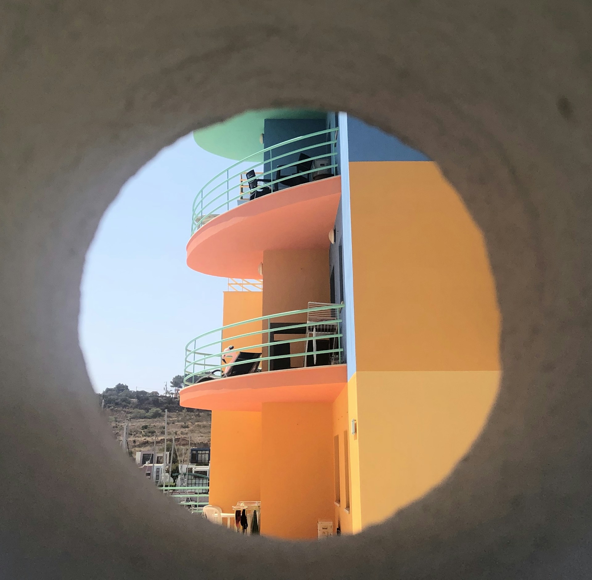 woman wearing yellow long-sleeved dress under white clouds and blue sky during daytime