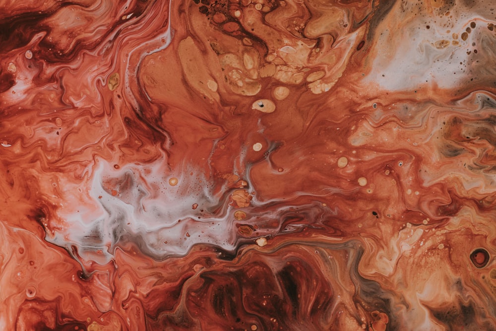a close up of a red and black marble