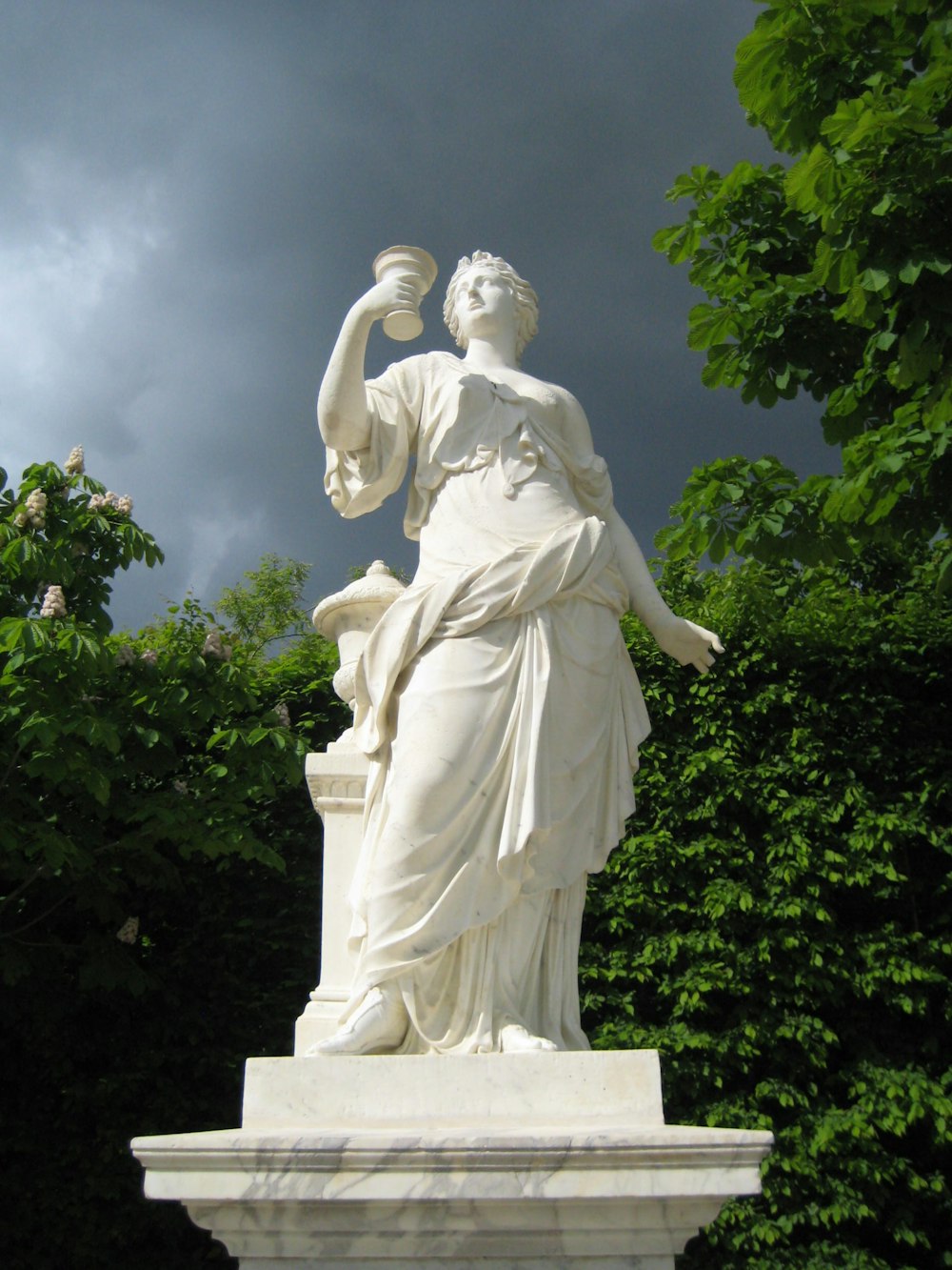 woman statue near tree