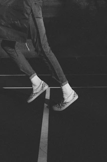 Casual streetwear outfit featuring klans shoes, worn by someone walking in an urban setting.