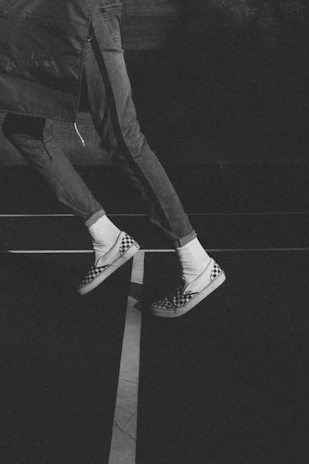 Casual streetwear outfit featuring klans shoes, worn by someone walking in an urban setting.