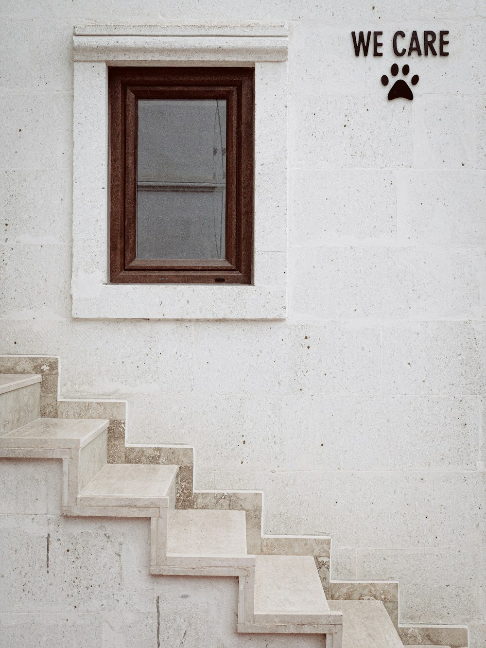 closed brown wooden framed glass window