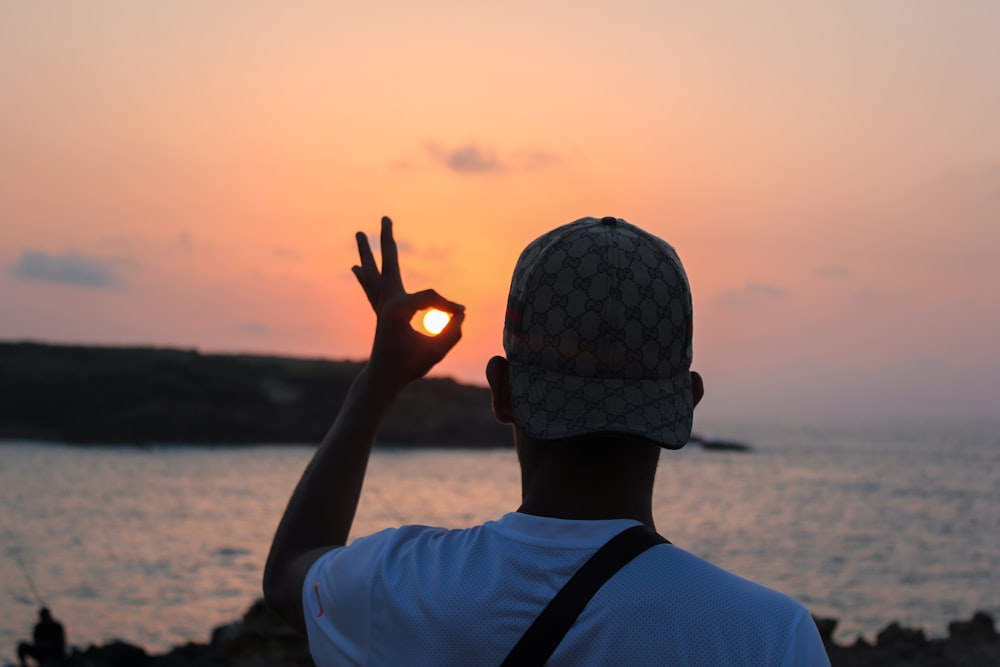 man standing near ocean