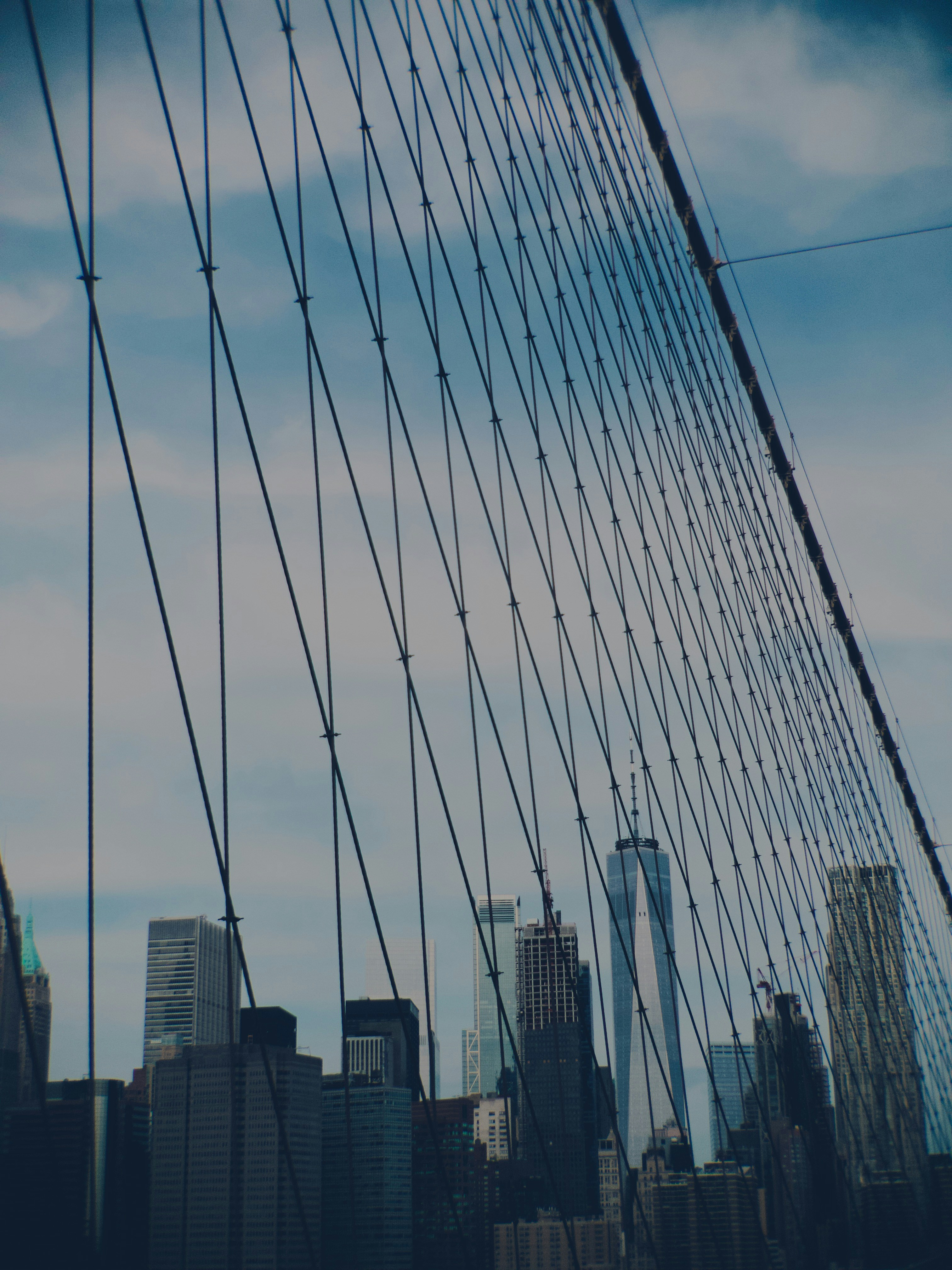 a view of a city from the brooklyn bridge