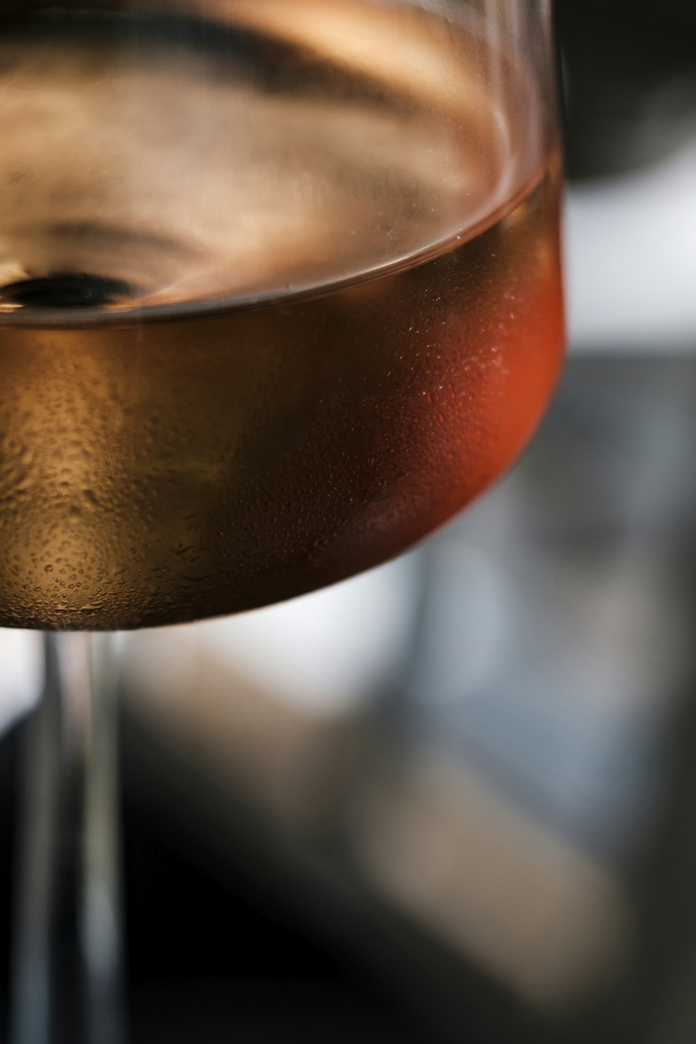 a close up of a wine glass filled with wine