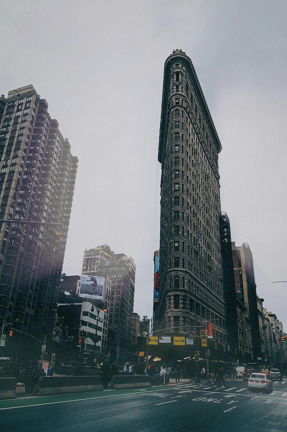 low angel photography of high rise building under gray sky