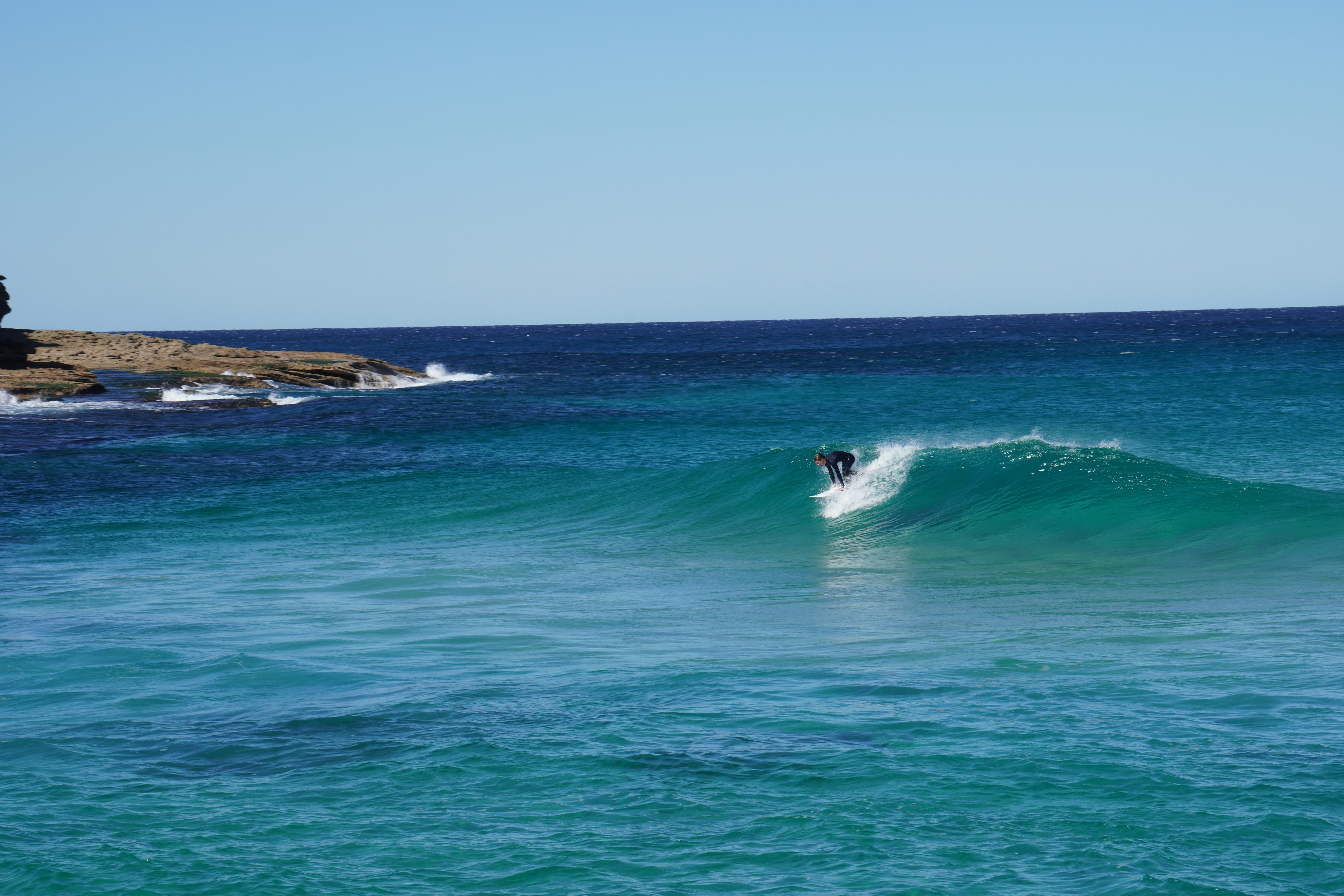 Man using surfboard on sea at daytime photo Free Bondi beach nsw Image on Unsplash