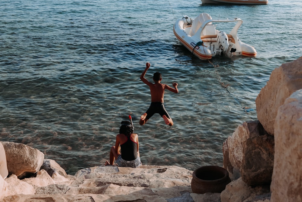 man and woman near shore