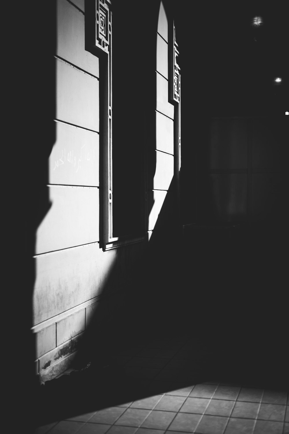 a black and white photo of a hallway