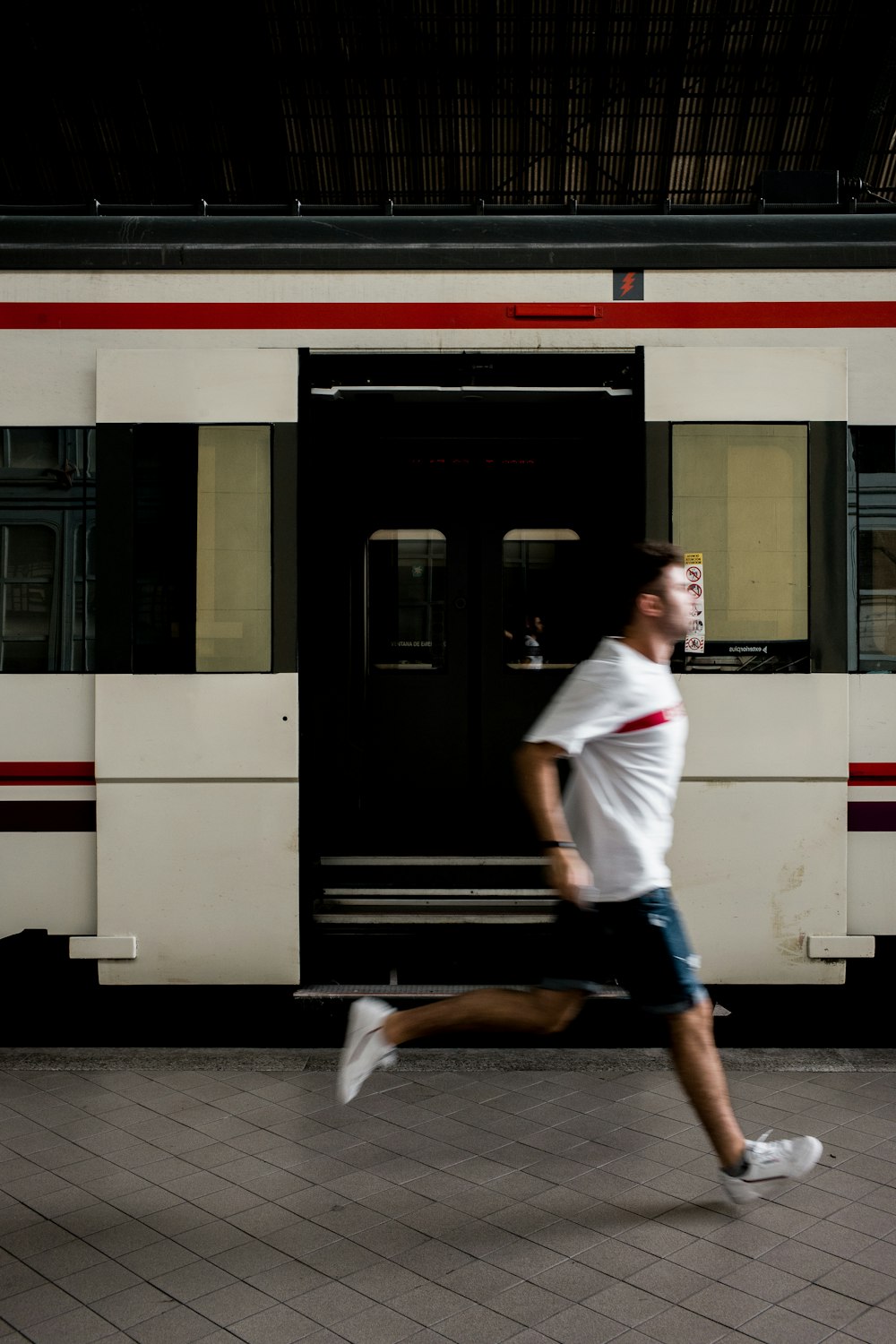 man runs near train