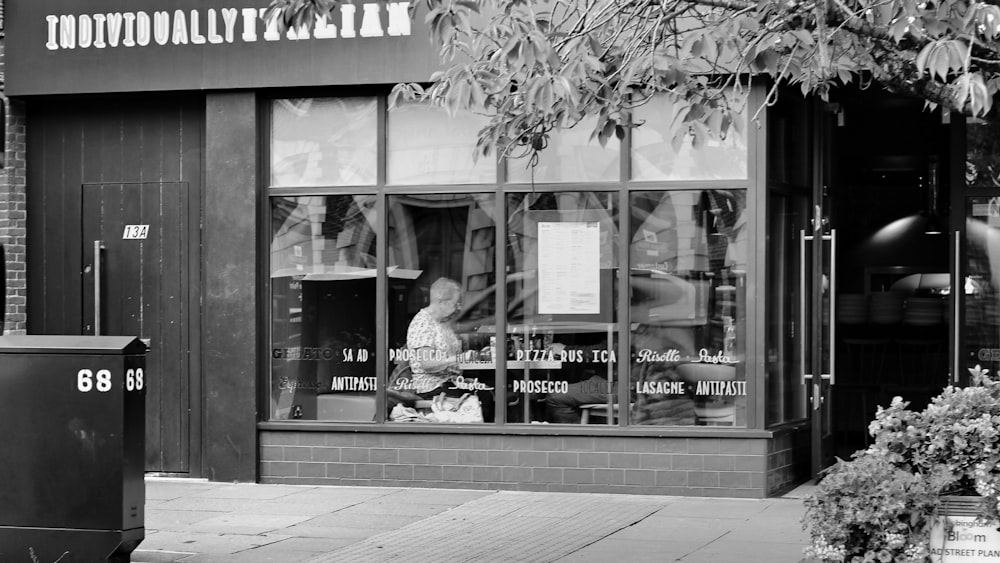 a black and white photo of a store front