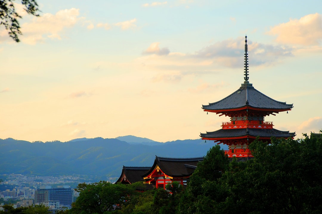 red concrete temple at daytime,