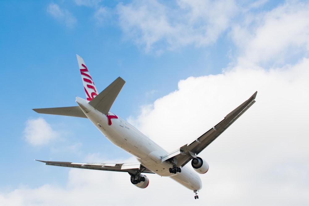 white and red airliner