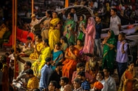 A diverse group of people engaged in prayer together.