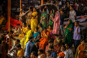 A group of diverse people engaged in a community prayer.