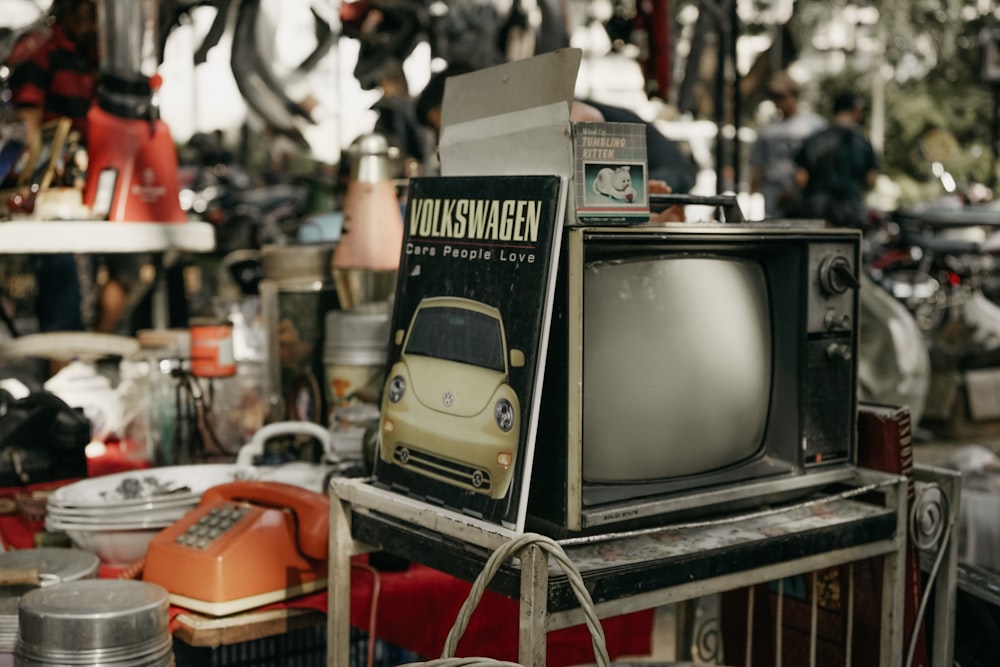 vintage black CRT TV on rack