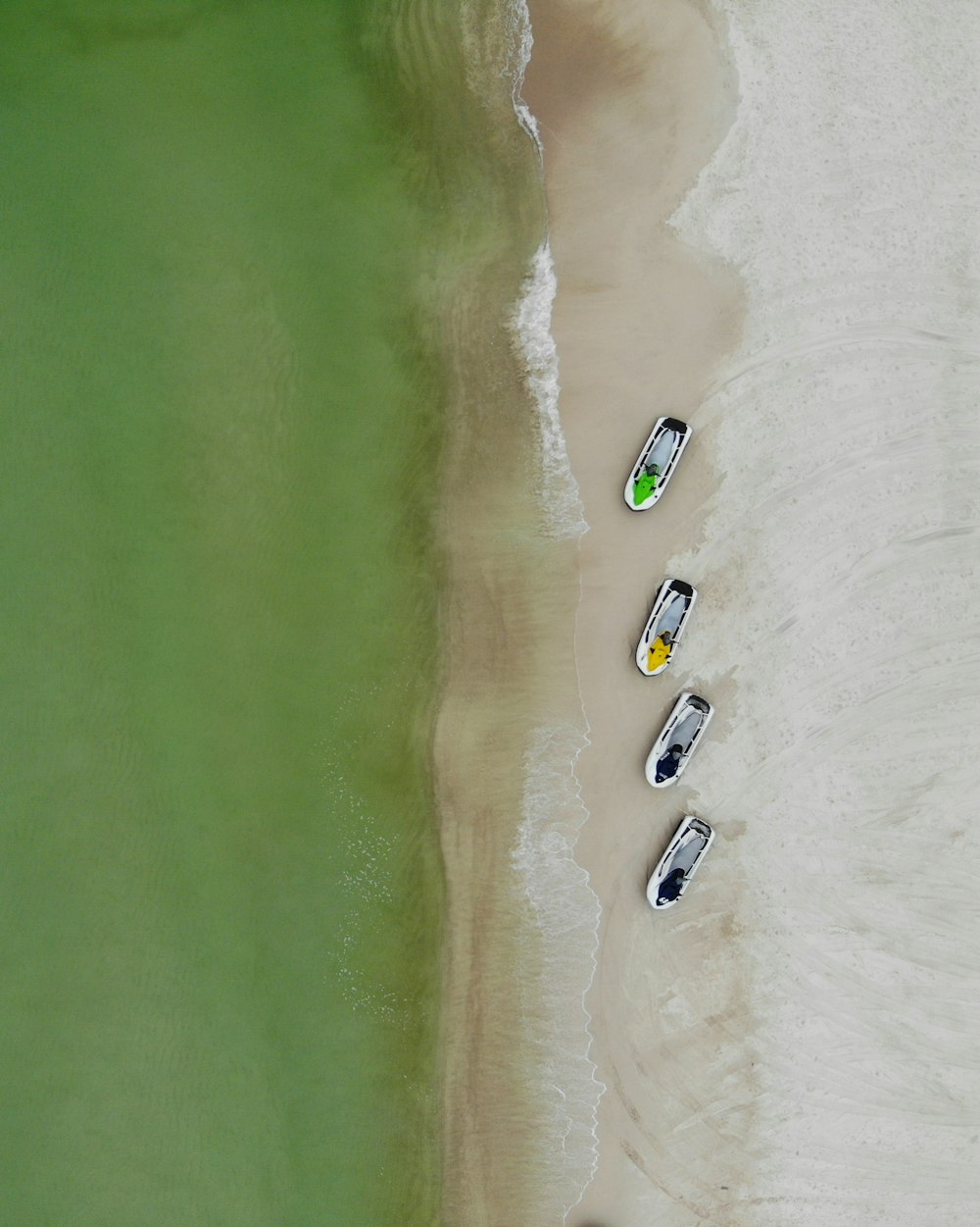 four powerboat in seashore