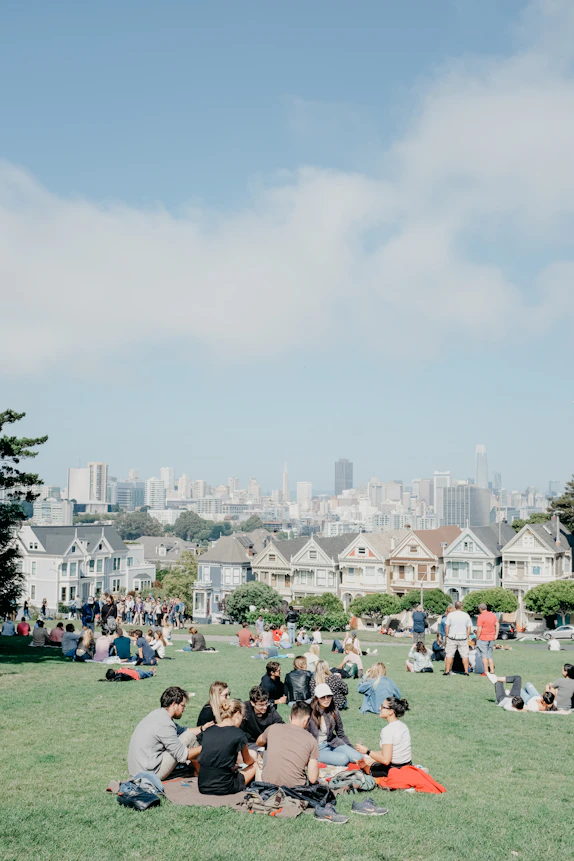 people sitting on grass field during daytime