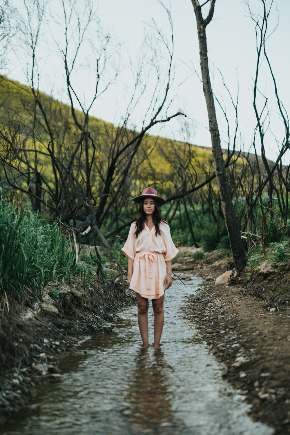 women's beige quarter-sleeved dress during daytime