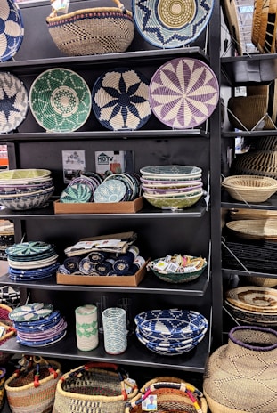 Close-up of colorful household goods displayed invitingly on shelves.