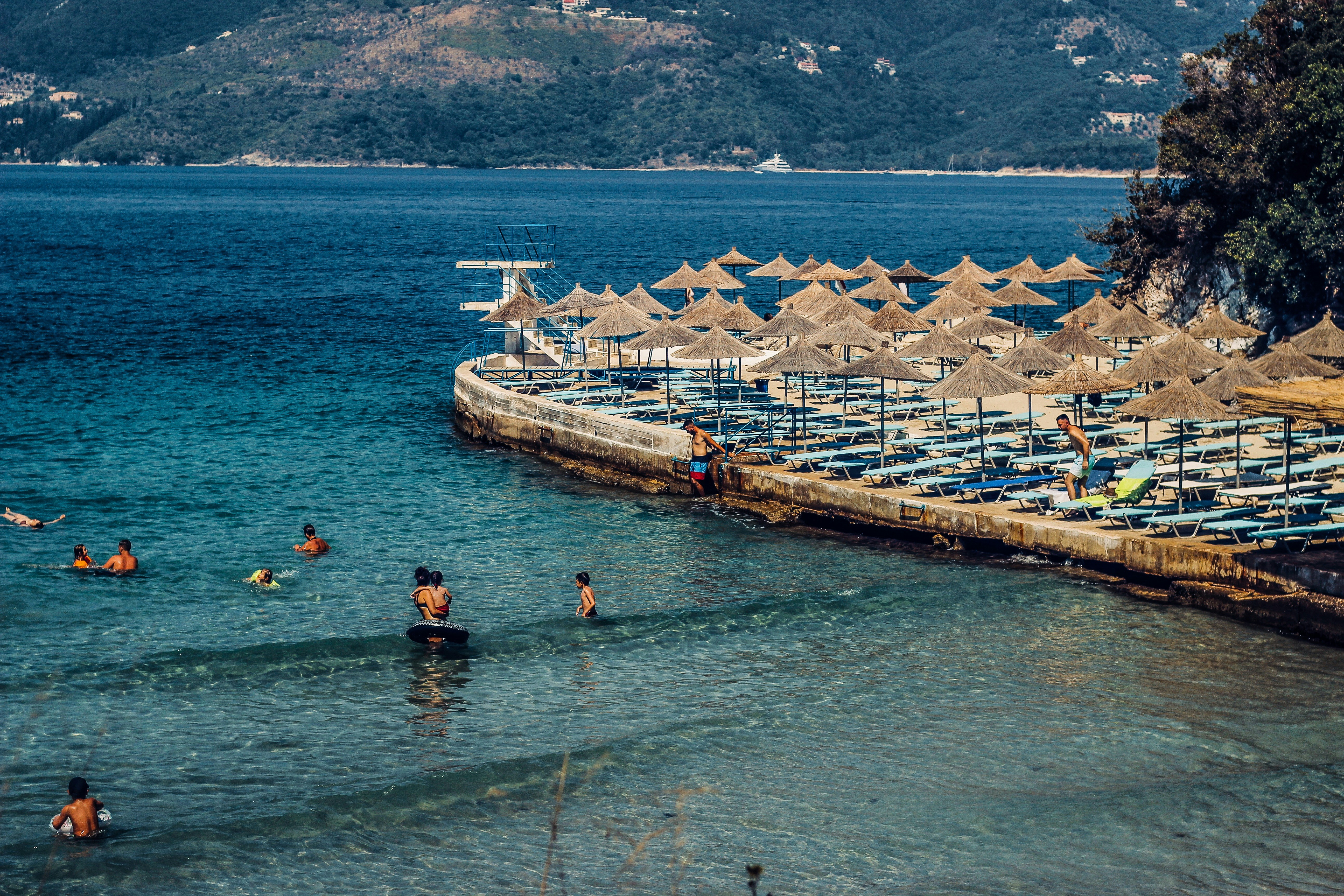 people swimming in the beach during daytime, Moments