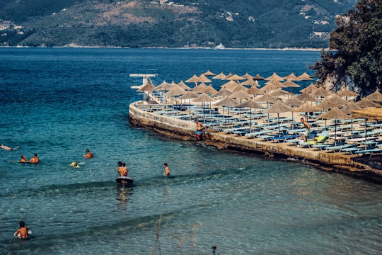 people swimming in the beach during daytime in Saranda Albania