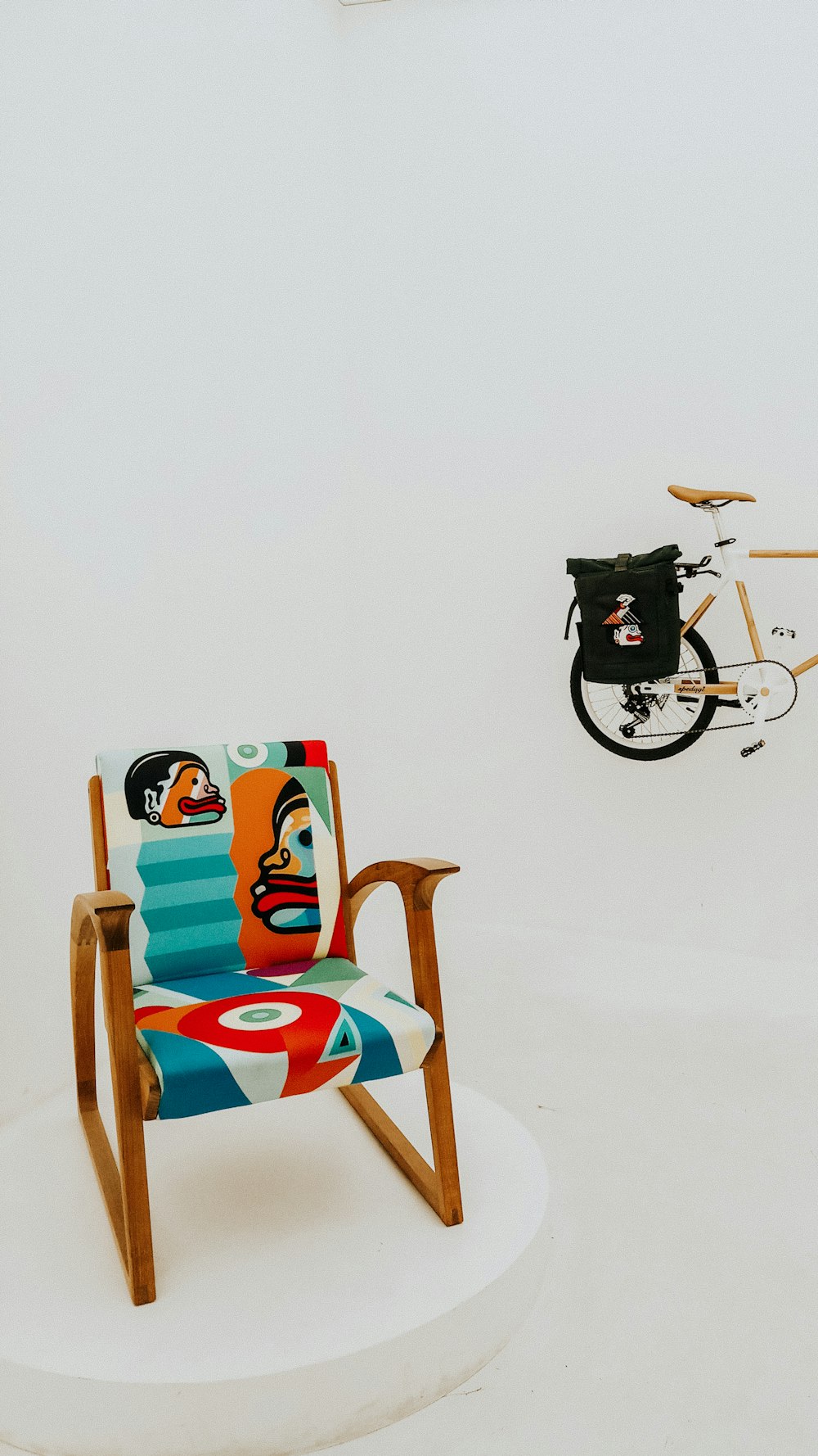 blue, red, and brown padded armchair