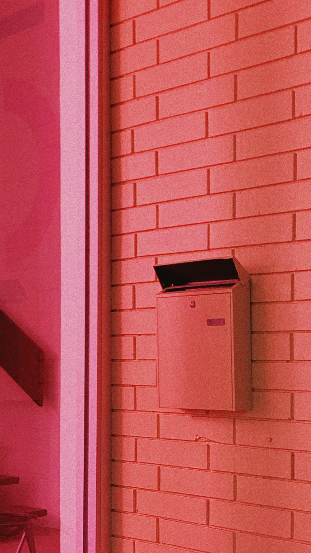 white mail box on wall