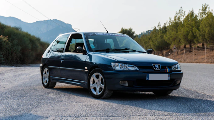 black Peugeot 3-door hatchback