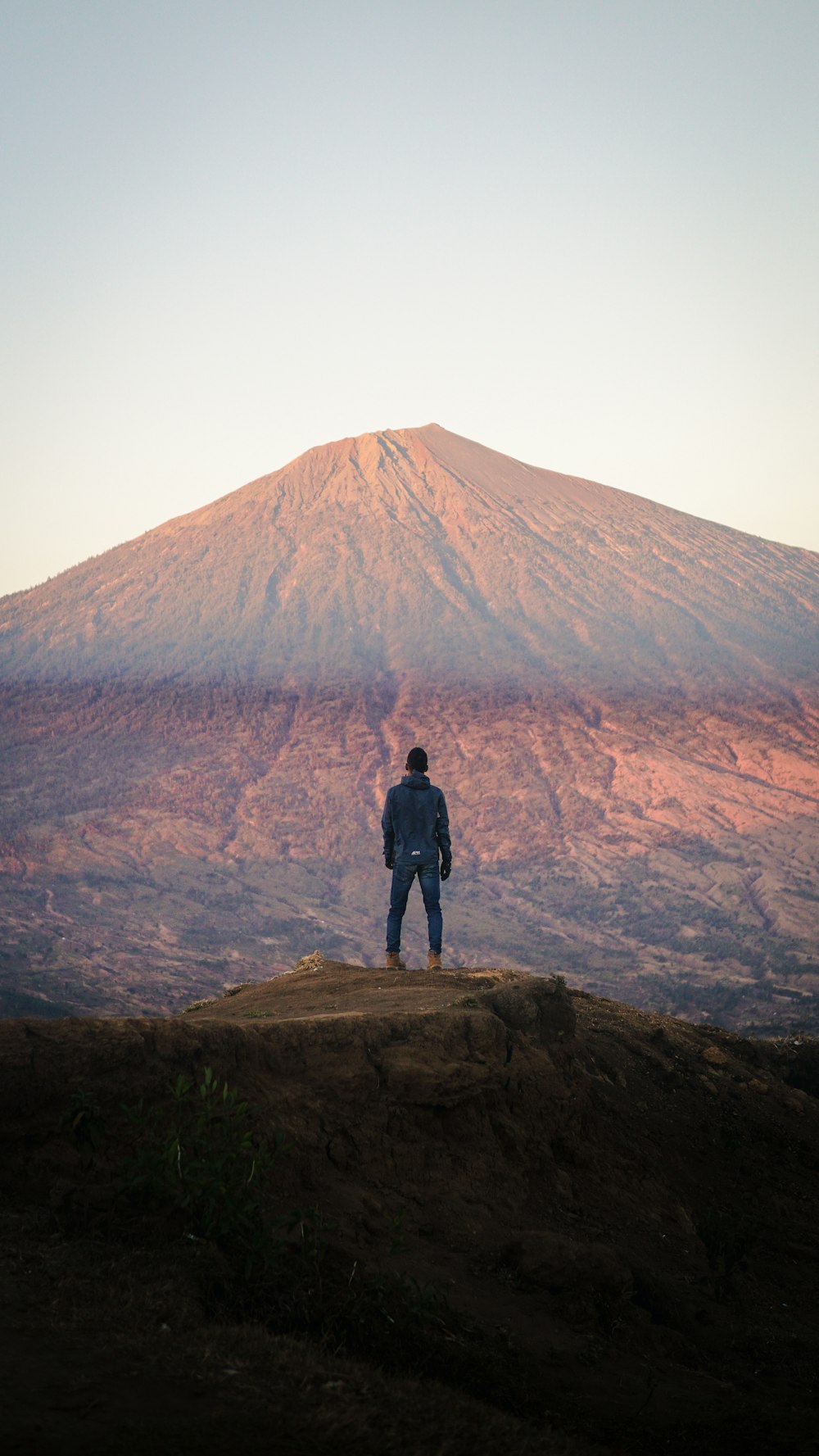 man looking at hill